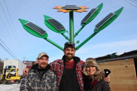 Beneath their “labour of love,” a 25 foot off-grid solar sunflower at Farmer’s Best along Bedford Highway, Sunflower Solar partners Keith Crews, Steven Weagle and Kirsten Weagle want Nova Scotians to know solar power has never been more accessible. (Cyndi Sweeney)